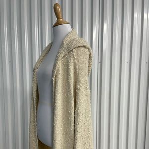 Never been worn white cardigan from the brand POL